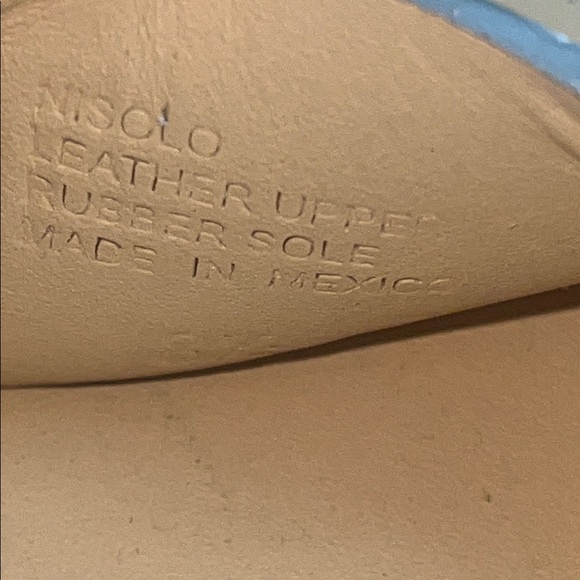 Nisolo Gray Leather Sandals with Chic Elevation on wooden platform. - Picture 9 of 11